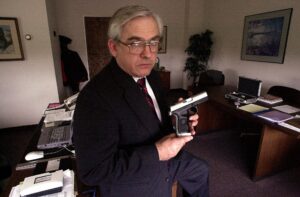 Former Smith & Wesson CEO Ed Shultz poses with a smart gun prototype.
