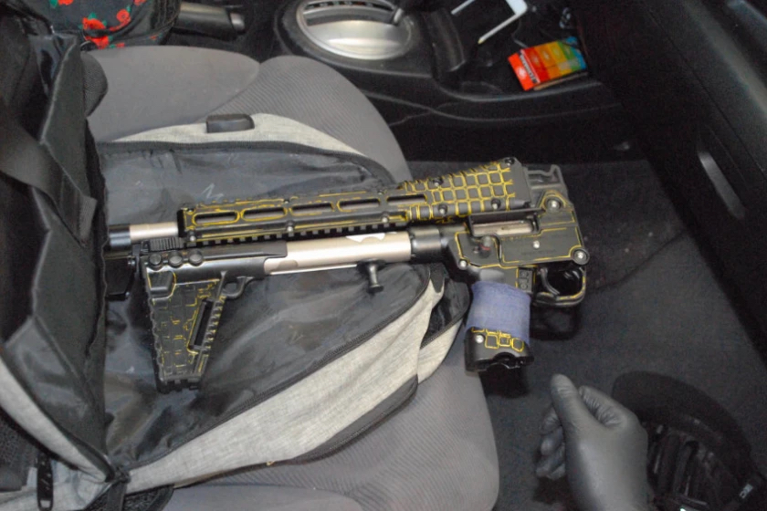 A Kel-Tec SUB2000 rifle sits folded on the Highland Park shooter's car seat.