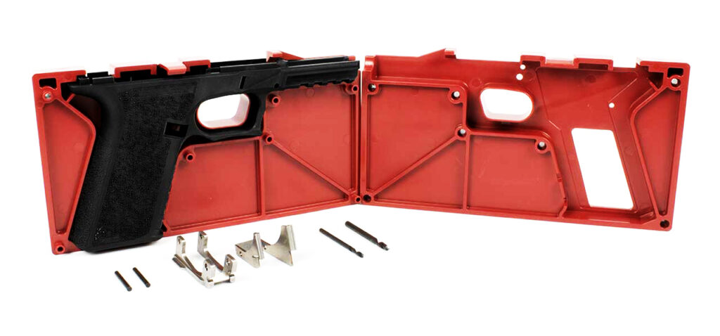 A Polymer80 pistol frame shown with a jig and tools