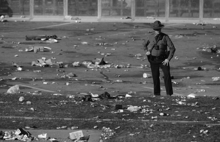 A law enforcement officer looks around the scene following a shooting at the Kansas City Chiefs Super Bowl celebration in Kansas City, Missouri on February 14, 2024.