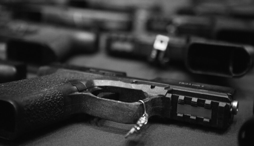 Ghost guns recovered in New York City are displayed on a table during a press conference.