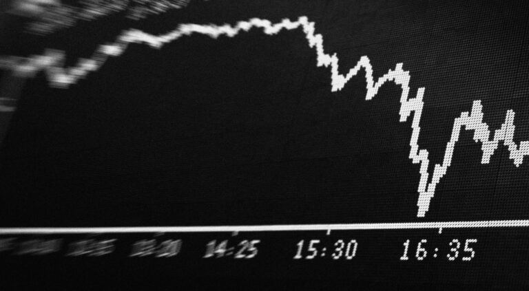 A stock price fluctuates and then drops on a digital screen.