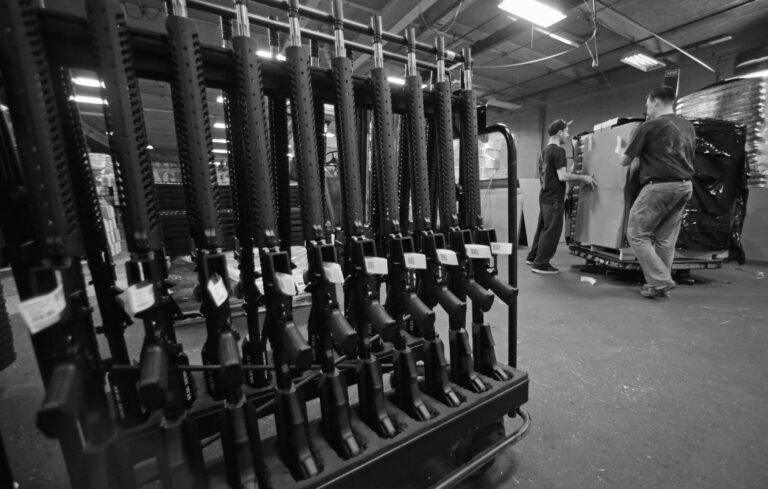 Workers move crates of AR-15 rifles at the Stag Arms facility in Connecticut in 2013.