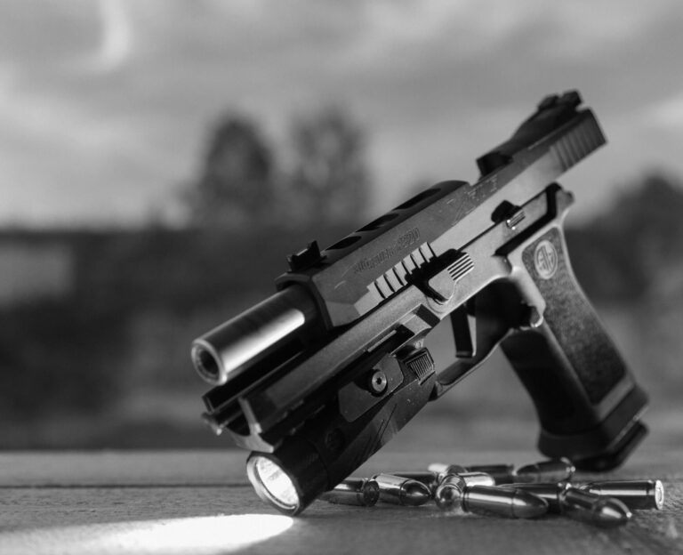 A Sig Sauer P320 pistol is shown with the slide locked open. Numerous lawsuits have called into question the safety of P320s in recent years.