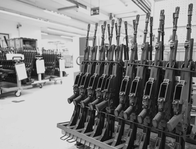 HK416 rifles are shown on a rack at a weapons factory. According to the ATF's AFMER for 2023, gun makers have scaled their production back after the pandemic.