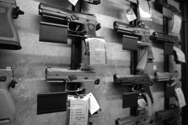 Sig Sauer P320 pistols are shown on display at a gun store in Maine near New Hampshire, where lawmakers recently enacted a law to protect the company from lawsuits.
