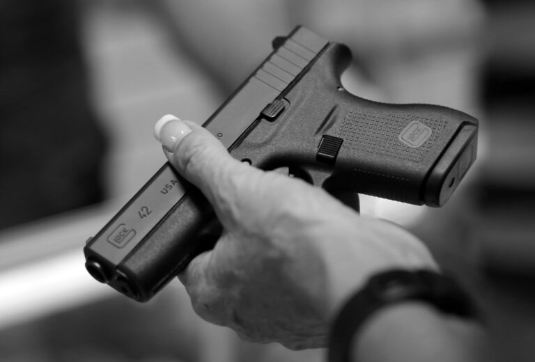 A woman holds a Glock pistol at a gun shop in California, a state that recently named the manufacturer as the top producer of crime guns.