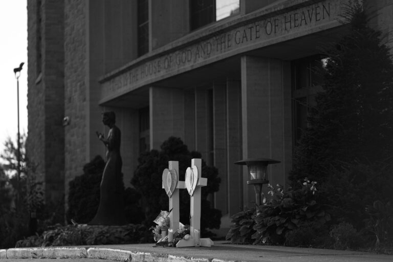 Crosses, flowers and other mementos were placed as a memorial at Annunciation Catholic School after a shooting on August 27, 2025.
