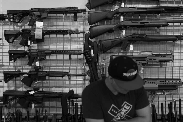 AR-15s and shotguns are shown on display at a gun shop in California. Gun sales have dropped significantly since President Trump took often.