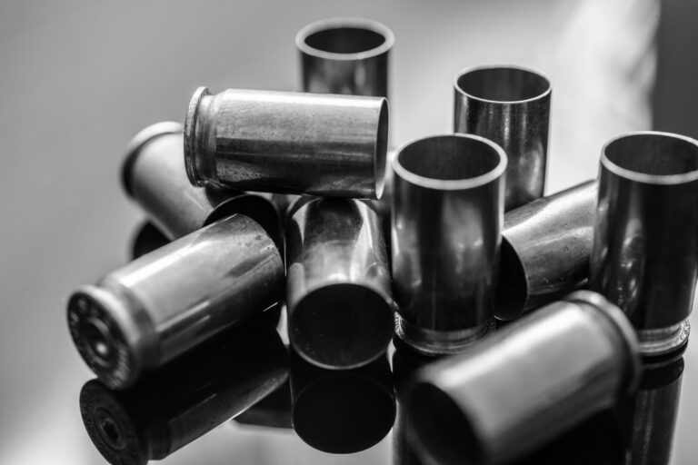 A pile of spent shell casings is shown. With microstamping, a special code would be imprinted on the backs of each of these spent casings to help police identify the gun's owner.