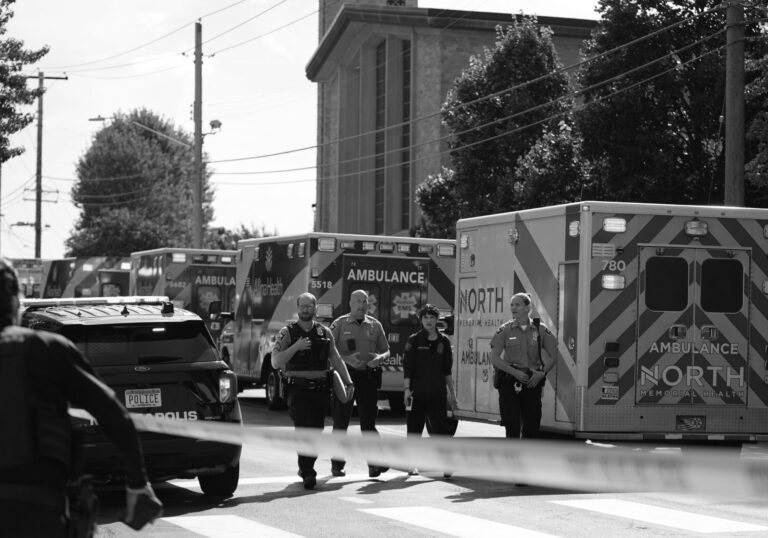 Police gather outside the Annunciation Catholic School in Minneapolis after a mass shooting in August. Days after the shooting, the NSSF blasted lawmakers who proposed new gun safety measures.