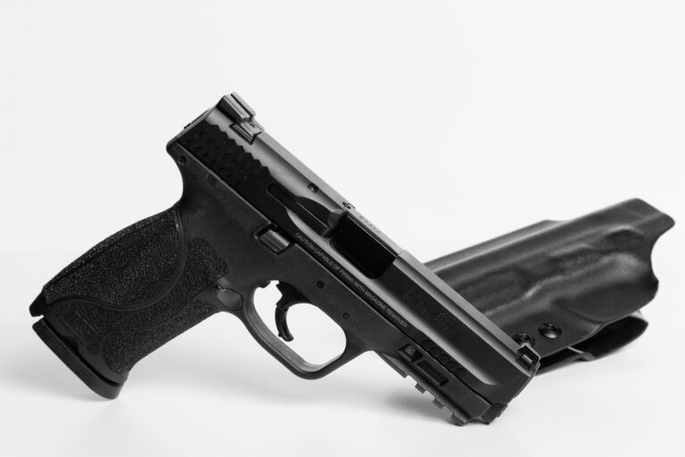 A Smith & Wesson M&P M2.0 pistol is shown with a black holster. A company called Freedom Finger Triggers recently debuted an FRT for the pistol series, alongside those for Taurus TX22 pistols.