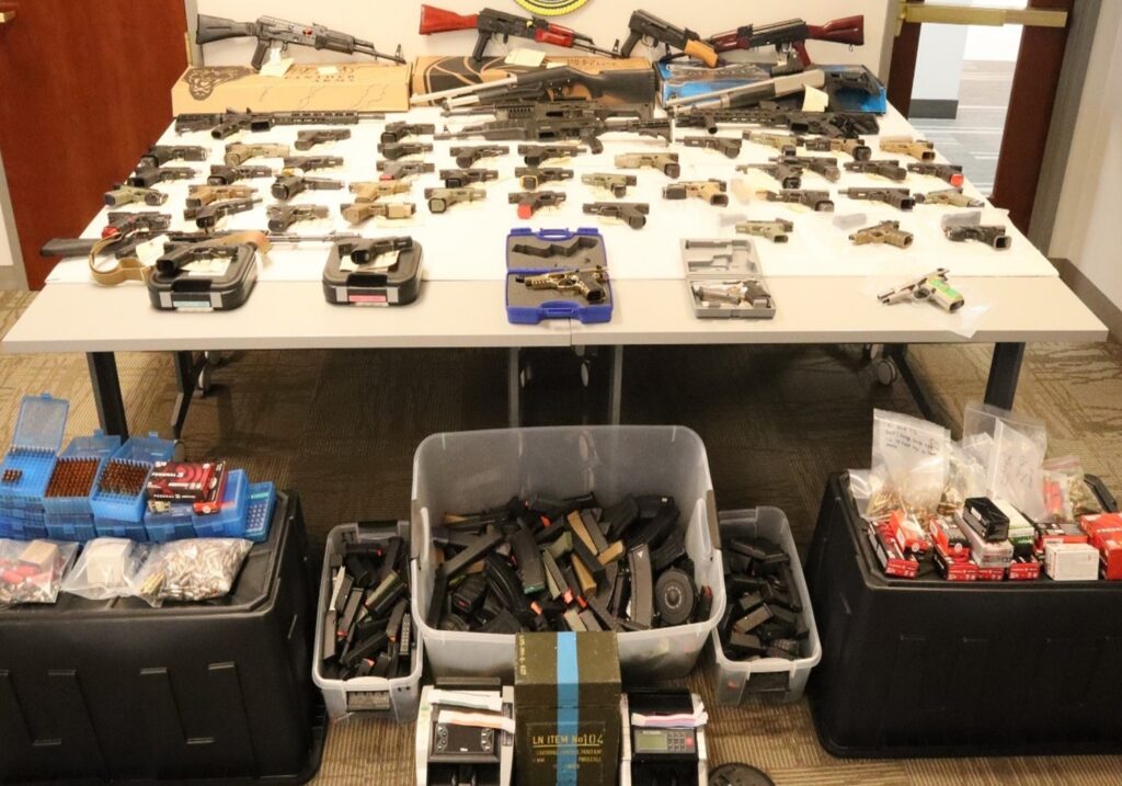Guns, magazines, and ammunition seized by police investigating Sune-Giron’s trafficking scheme.