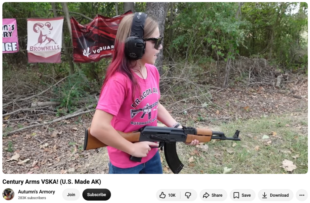 A screenshot of an Autumn's Armory video showing her firing an AK.