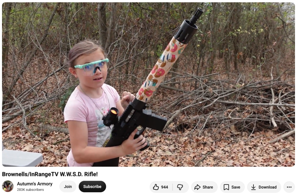 A screenshot of an Autumn's Armory video showing her firing an AR-15.